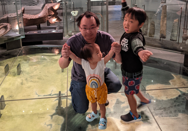 Chris Joe, our React Developer and his children playing in a Museum